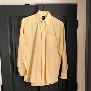 Jos A Bank pale yellow button down dress shirt